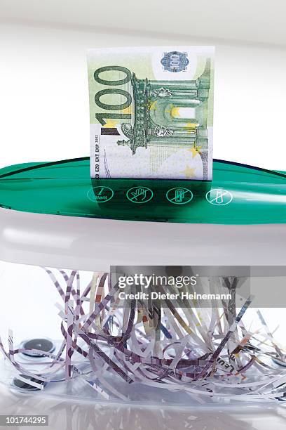 100 euro notes in shredder - paper shredder on white stock pictures, royalty-free photos & images