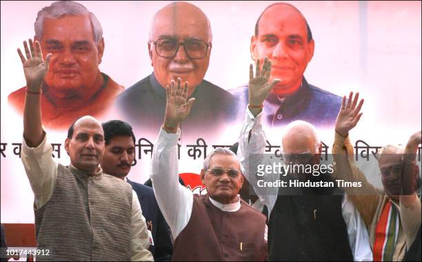 Former Prime Minister Atal Bihari Vajpayee, senior BJP leaders LK Advani, Murli Manohar Joshi and Rajnath Singh wave to party activists during a...
