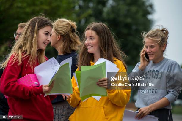Students embrace each other after opening their A Level exam results at Lady Eleanor Holles school on August 16, 2018 in Hampton, United Kingdom. A...