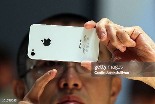 Member of the media inspects the new iPhone 4 at the 2010 Apple World Wide Developers conference June 7, 2010 in San Francisco, California. Apple CEO...