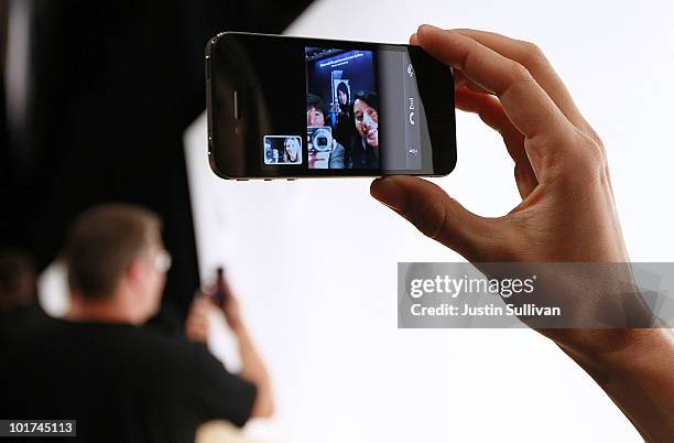 An Apple employee demonstrates "Face Time" on the new iPhone 4 at the 2010 Apple World Wide Developers conference June 7, 2010 in San Francisco,...