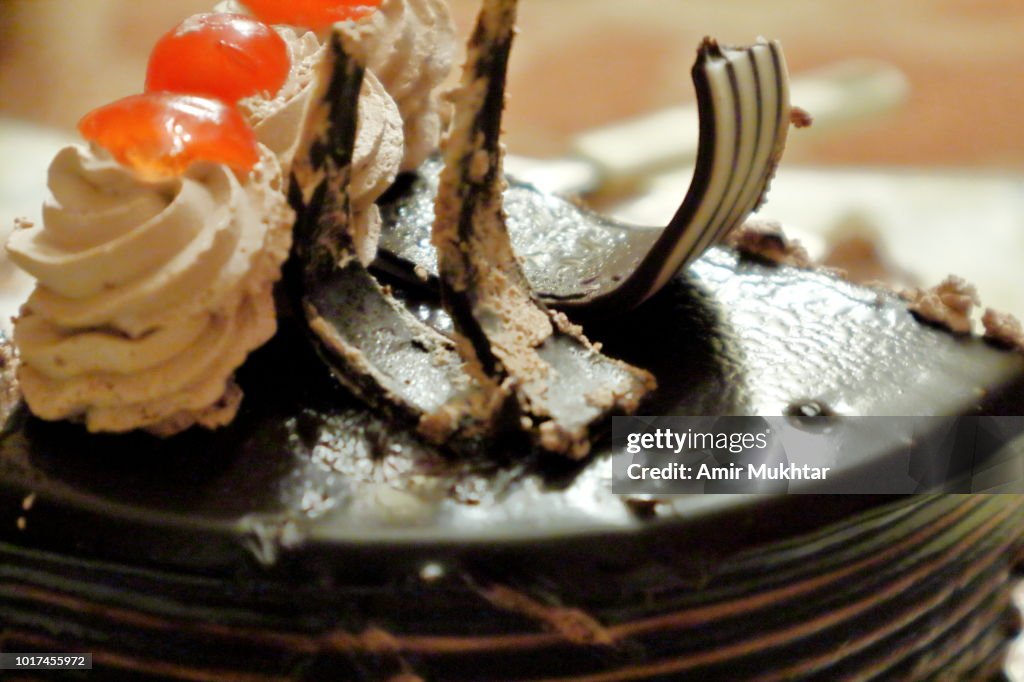 Chocolate cake with cherry on top
