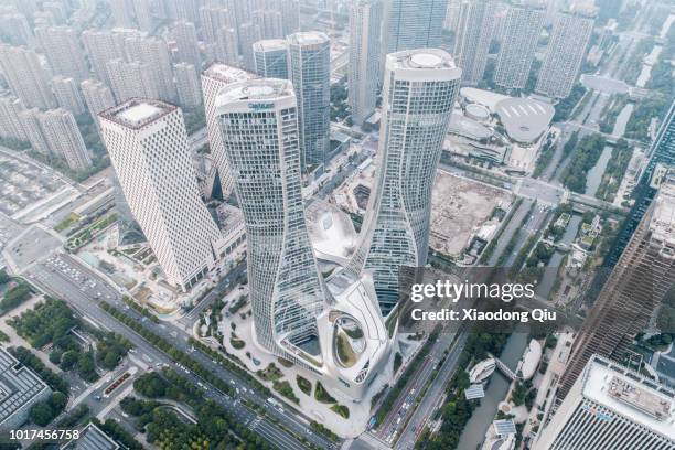 aerial view of hangzhou raffles city at dusk - hangzhou stock pictures, royalty-free photos & images