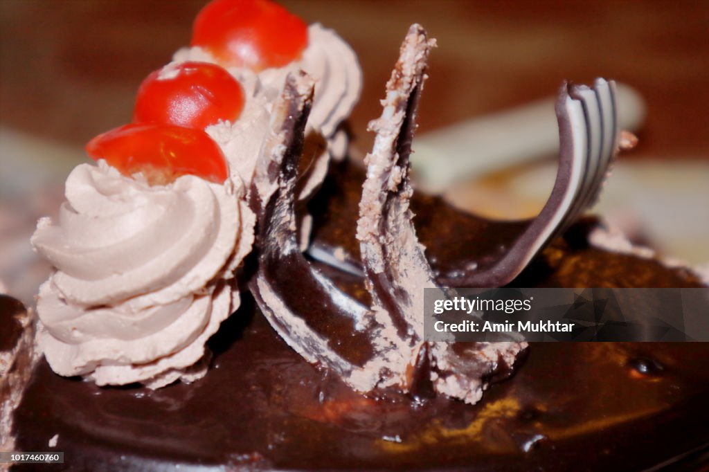 Chocolate cake with cherry on top