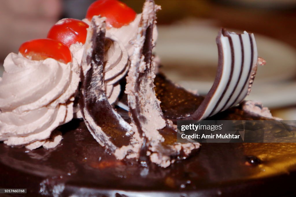 Chocolate cake with cherry on top