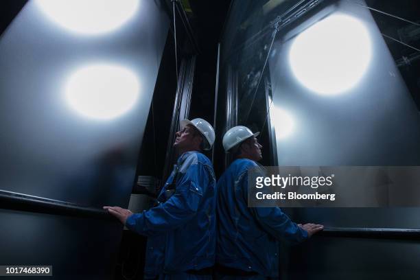 An employee inspects sheet steel during quality checks on the electrolytic tinning and chromium coating line at the Thyssenkrupp Rasselstein GmbH...