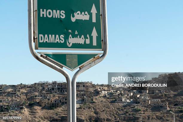 This picture shows a road sign in Rastan, central Homs province, on August 15, 2018. Syria's government forces took back the rebel towns of...