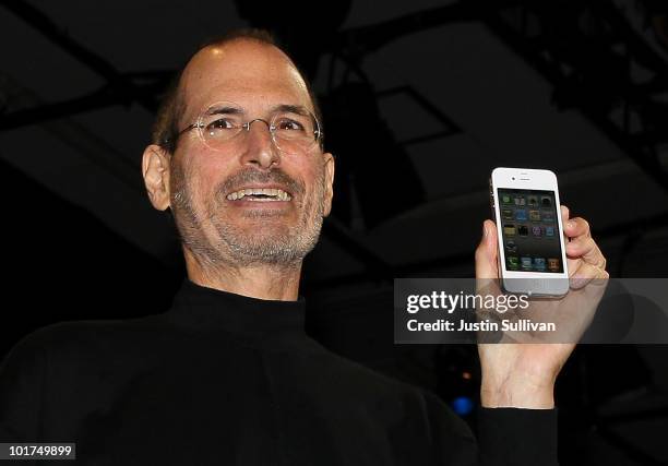 Apple CEO Steve Jobs holds the new iPhone 4 after he delivered the opening keynote address at the 2010 Apple World Wide Developers conference June 7,...