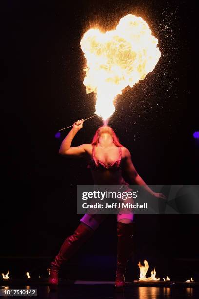 Kitty Bang Bang from Little Death Club performs her fire routine to mark the 250th anniversary of the circus at the Underbelly's Circus Hub on August...