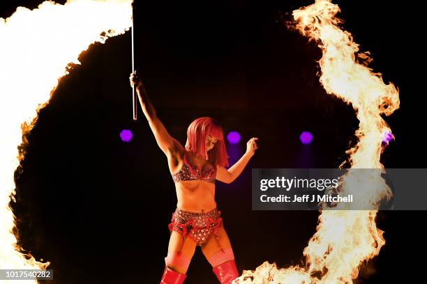 Kitty Bang Bang from Little Death Club performs her fire routine to mark the 250th anniversary of the circus at the Underbelly's Circus Hub on August...