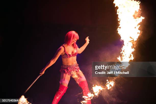 Kitty Bang Bang from Little Death Club performs her fire routine to mark the 250th anniversary of the circus at the Underbelly's Circus Hub on August...