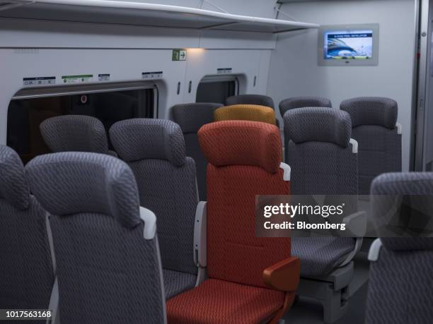 Rows of passenger seats stand inside a Guangzhou-Shenzhen-Hong Kong Express Rail Link train in Hong Kong, China, on Thursday, Aug. 16, 2018. The...