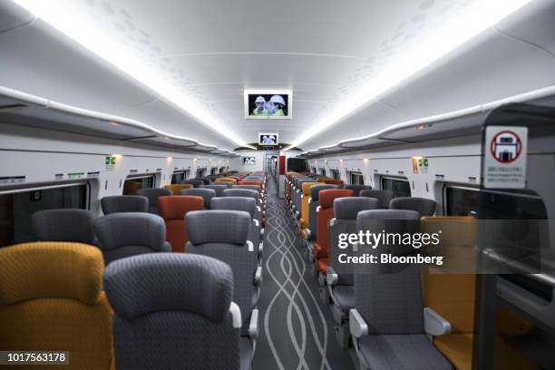 Rows of passenger seats stand inside a Guangzhou-Shenzhen-Hong Kong Express Rail Link train in Hong Kong, China, on Thursday, Aug. 16, 2018. The...