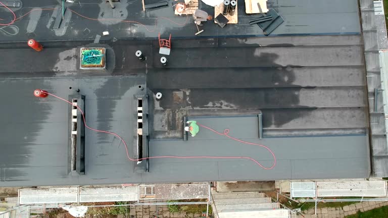 https://media.gettyimages.com/id/1017569000/video/workers-repair-waterproofing-house-roof-aerial.jpg?b=1&s=640x640&k=20&c=Ld2qlWelAnz1QTpiSsQZCLm5KW6fXrcofnzXqVmEMAs=