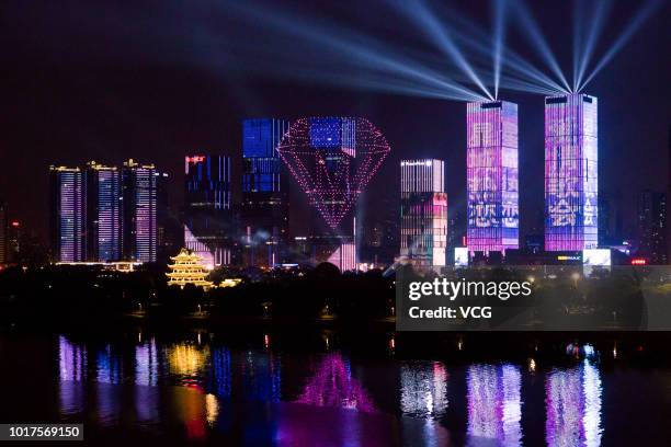 Seven hundred seventy-seven drones form a diamond pattern during a light show over the Orange Isle on August 10, 2018 in Changsha, Hunan Province of...