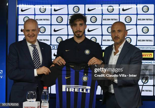 The new signing of FC Internazionale Milano Sime Vrsaljko poses with Sportif Director of FC Internazionale Milano Piero Ausilio and Chief Football...