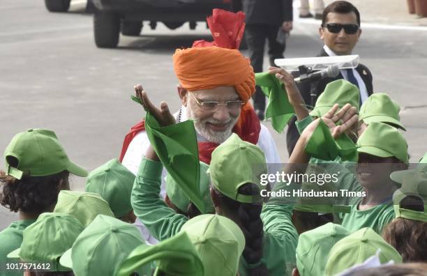 Prime Minister Narendra Modi meets with school childrens after addressed the nation from the Red Fort on the 72nd Independence Day, his fifth and...