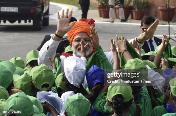 Prime Minister Narendra Modi meets with school childrens after addressed the nation from the Red Fort on the 72nd Independence Day, his fifth and...