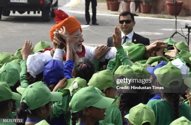 Prime Minister Narendra Modi meets with school childrens after addressed the nation from the Red Fort on the 72nd Independence Day, his fifth and...