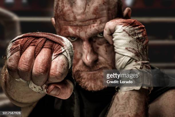 mma fighter wearing bloody straps - mixed martial arts stock pictures, royalty-free photos & images