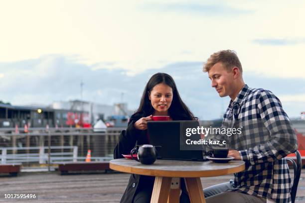 casual business meeting at an outdoor cafe - new zealander stock pictures, royalty-free photos & images