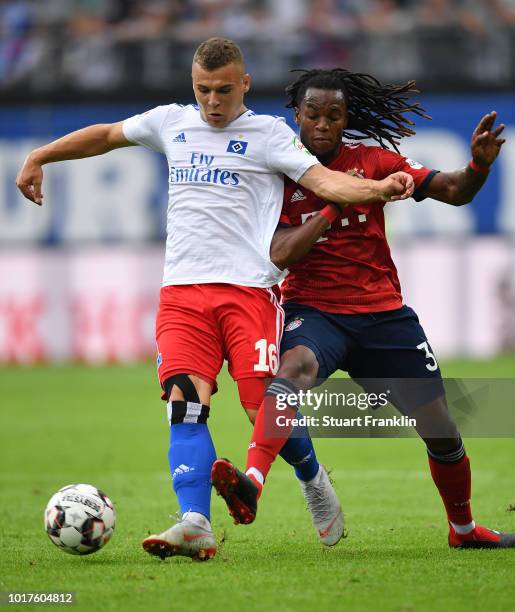 Vasilije Janjicic of Hamburg is challenged by Renato Sanches of Muenchen during the friendly match between Hamburger SV and Bayern Muenchen at...