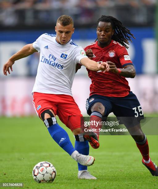 Vasilije Janjicic of Hamburg is challenged by Renato Sanches of Muenchen during the friendly match between Hamburger SV and Bayern Muenchen at...
