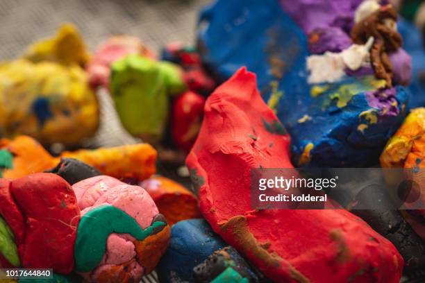 close-up of colorful messy play doh - clay stock-fotos und bilder