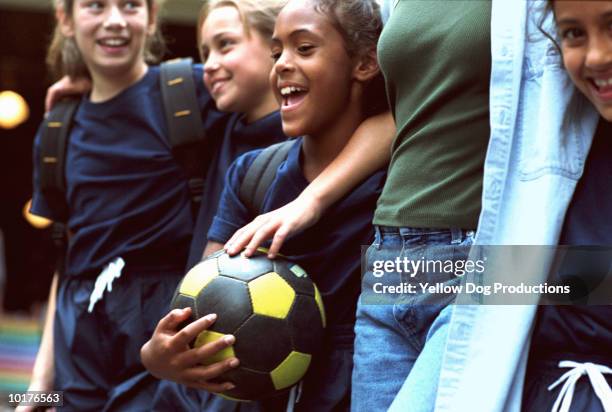 girls in soccer team with adult woman - soccer mom stock pictures, royalty-free photos & images