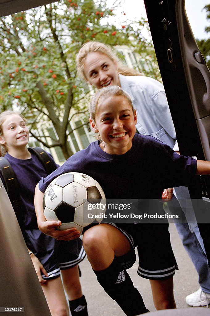 GIRLS GOING TO SOCCER PRACTICE WITH MOM