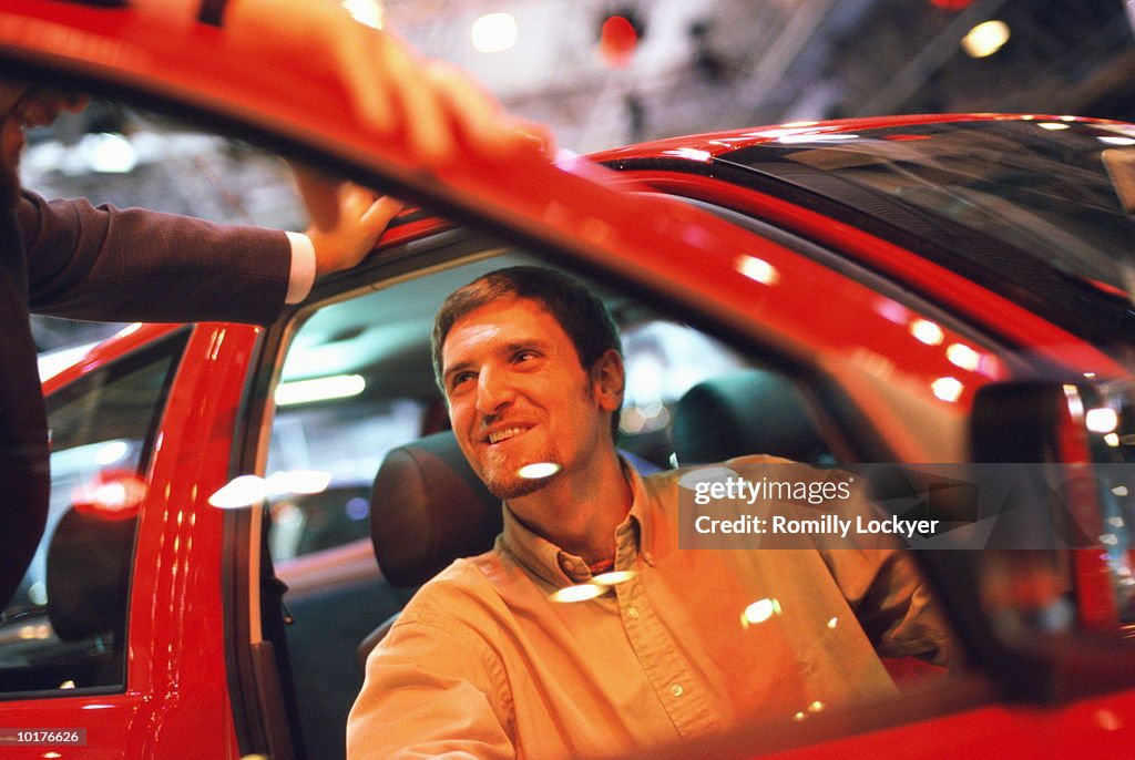CONSUMER AT MOTOR CAR SHOW