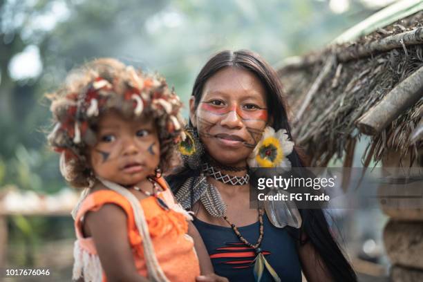 indigenous brazilian young woman and her child, portrait from guarani ethnicity - amazon jungle girls stock pictures, royalty-free photos & images