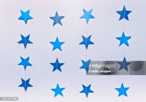 blue paper stars on white background. top view, flat lay - confetti white background stock pictures, royalty-free photos & images