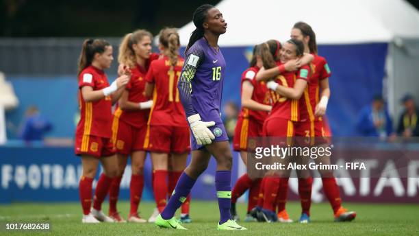 Goalkeeper Chiamaka Akarekor of Nigeria reacts as Patricia Guijarro of Spain celebrates her team's second goal with team mates during the FIFA U-20...