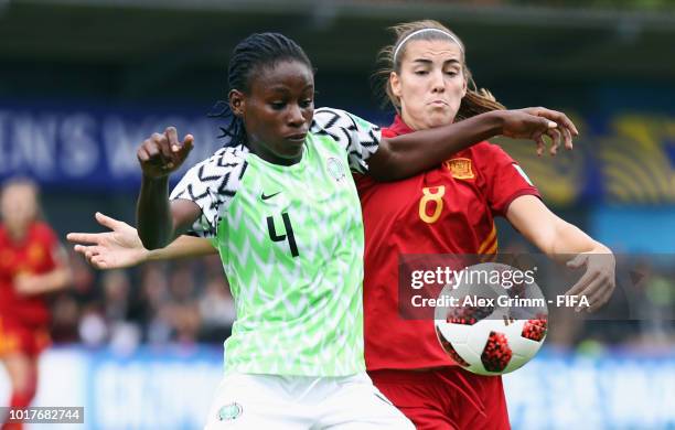 Christy Ucheibe of Nigeria is challenged by Patricia Guijarro of Spain during the FIFA U-20 Women's World Cup France 2018 Quarter Final quarter final...