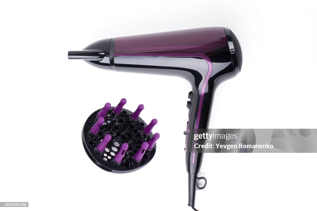 Violet hairdryer isolated on a white background