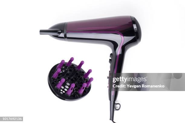 violet hairdryer isolated on a white background - brushing photos et images de collection