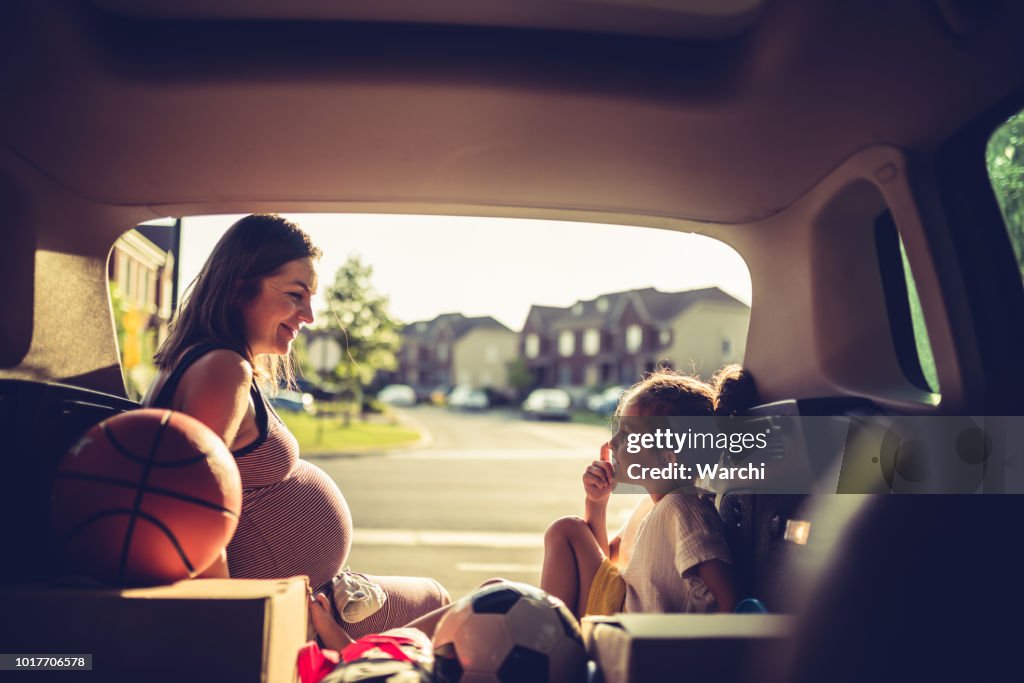 Mother and daughter having fun before the trip