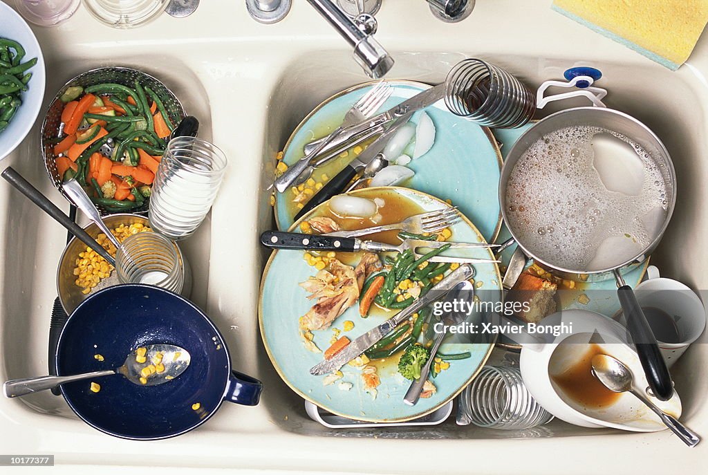 DIRTY DISHES IN KITCHEN SINK