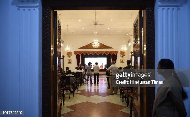 Group of media persons seen inside the Banquet hall of the Karnataka Raj Bhavan, the residence of the state Governor on August 16, 2018 in Bengaluru,...