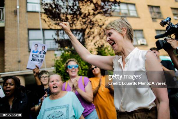 Democratic gubernatorial candidate Cynthia Nixon waves to attendees as she arrives to speak in a rally for universal rent control on August 16, 2018...