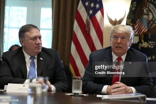 President Donald Trump, right, speaks while Mike Pompeo, U.S. Secretary of state, listens during a meeting in the Cabinet Room of the White House in...