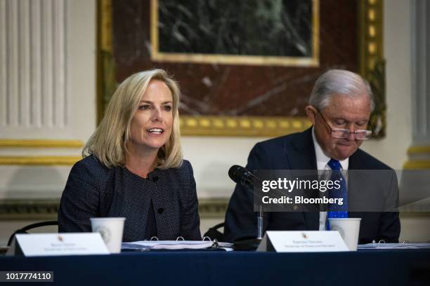 Kirstjen Nielsen, U.S. Secretary of Homeland Security , left, speaks as Jeff Sessions, U.S. Attorney general, listens during a Federal Commission on...