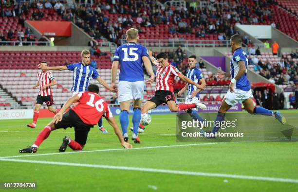 Luke O'Nien of Sunderland has his shot blocked during the Carabao Cup First Round match between Sunderland and Sheffield Wednesday at Stadium of...