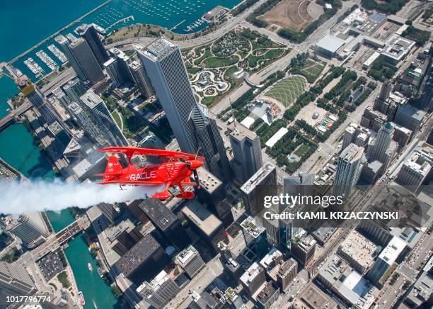 Hall of Fame Air Show Performer Sean D. Tucker flies his Oracle Challenger III aircraft over downtown Chicago as he prepares for the 60th annual...