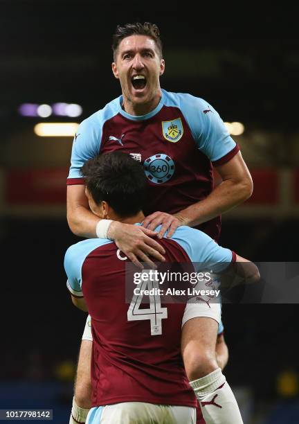 Stephen Ward of Burnley congratulates goal scorer Jack Cork during the UEFA Europa League third round qualifier second leg between Burnley and...