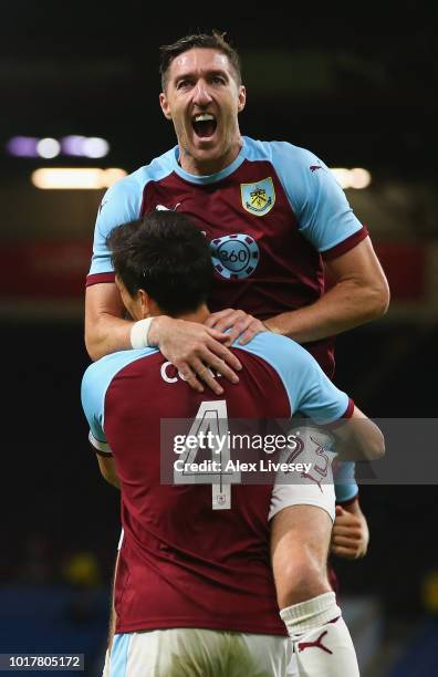 Stephen Ward of Burnley congratulates goal scorer Jack Cork during the UEFA Europa League third round qualifier second leg between Burnley and...