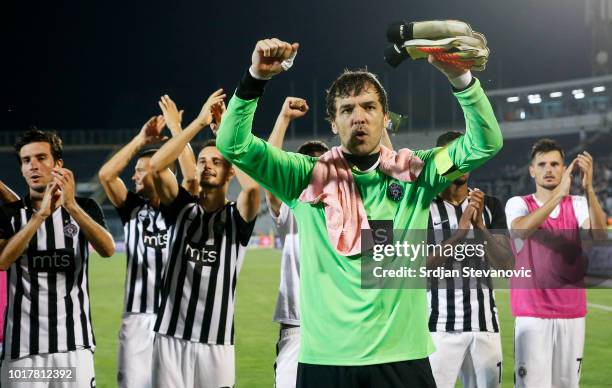 Goalkeeper Vladimir Stojkovic celebrates with team mates after the UEFA Europa League Third Round Qualifier Second Leg match between Partizan and...