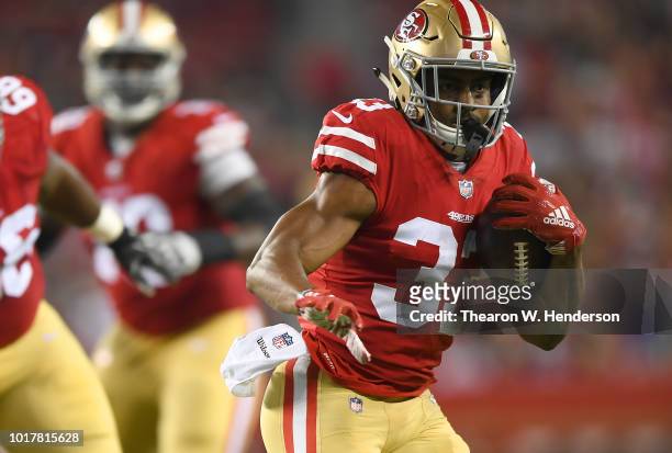 Tarvarus McFadden of the San Francisco 49ers carries the ball against the Dallas Cowboys in the fourth quarter of their NFL preseason football game...