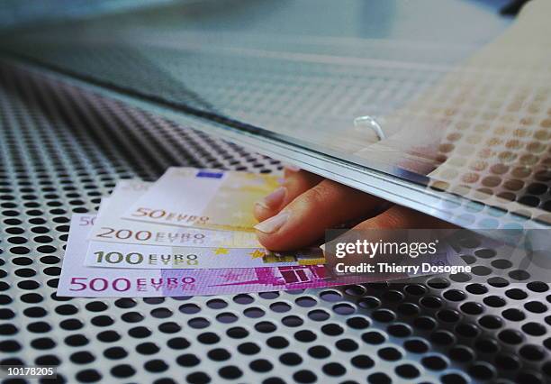 hand on euro banknotes, close up - bank teller stock pictures, royalty-free photos & images